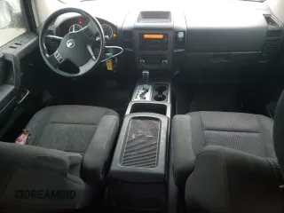 2010 Nissan Titan SE with VIN 1N6BA0ED7AN324632, listed as a Copart auction lot 57095185 with 156,391 mi miles and Salvage title. Bid and sale history available at DreamBid. Image 8.