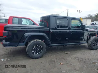 2021 Jeep Gladiator Rubicon z VIN 1C6JJTBG8ML524215, wystawiony jako IAAI lot #41829990 z przebiegiem 62 942 mil mil oraz . Historia ofert i sprzedaży dostępna na DreamBid. Obrazek 14.