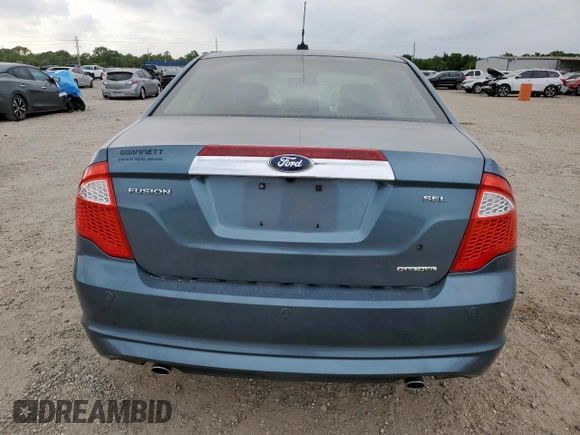 2012 Ford Fusion SEL z VIN 3FAHP0JG1CR141390, wystawiony jako Copart lot #59308505 z przebiegiem 63 955 mil mil oraz Szkoda całkowita • Salvage title. Historia ofert i sprzedaży dostępna na DreamBid. Obrazek 6.