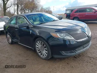 2014 Lincoln MKS with VIN 1LNHL9DKXEG610203, listed as a IAAI auction lot 40890151 with 114,200 mi miles. Bid and sale history available at carsss.com. Image 1.