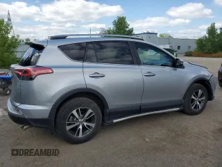 2018 Toyota RAV4 LE with VIN 2T3BFREV8JW788362, listed as a Copart auction lot 64053735 with 124,668 mi miles and Salvage title. Bid and sale history available at DreamBid. Image 3.
