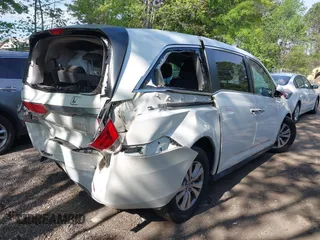 2014 Honda Odyssey EX-L with VIN 5FNRL5H63EB064854, listed as a IAAI auction lot 42102704 with 148,536 mi miles and . Bid and sale history available at carsss.com. Image 4.