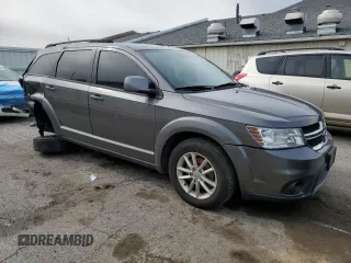 2013 Dodge Journey SXT with VIN 3C4PDCBG5DT695888, listed as a Copart auction lot 50302485 with 126,720 mi miles and Salvage Title. Bid and sale history available at DreamBid. Image 4.