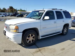 2003 GMC Yukon Denali z VIN 1GKEK63U93J124157, wystawiony jako Copart lot #51375095 z przebiegiem 204 286 mil mil oraz Tytuł czysty. Historia ofert i sprzedaży dostępna na DreamBid. Obrazek 1.
