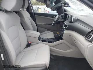 2019 Hyundai Tucson Value with VIN KM8J33A40KU999340, listed as a IAAI auction lot 41876380 with 52,752 mi miles. Bid and sale history available at carsss.com. Image 5.