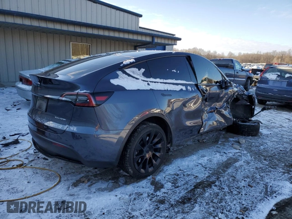 2023 Tesla Model Y Long Range with VIN 7SAYGDEE6PF752570, listed as a Copart auction lot 84927794 with 52,297 mi miles and Salvage Title. Bid and sale history available at DreamBid. Image 3.