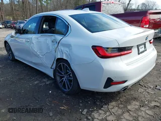 2022 BMW 3 Series 330i with VIN WBA5R1C01NFM20381, listed as a IAAI auction lot 41579020 with 37,874 mi miles. Bid and sale history available at carsss.com. Image 3.