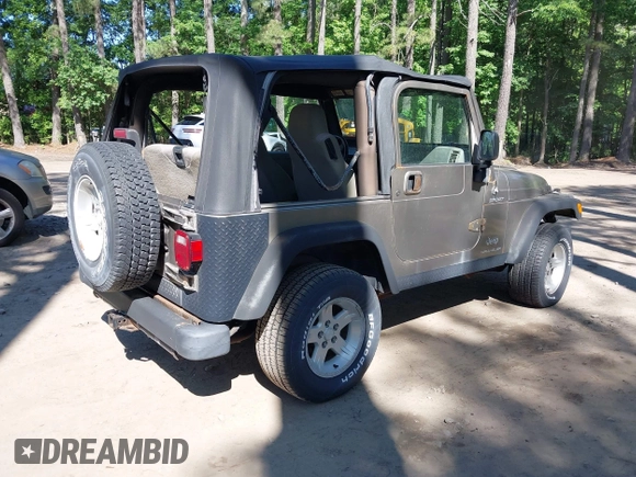2003 Jeep Wrangler Sport with VIN 1J4FA49S13P313180, listed as a IAAI auction lot 42349673 with 141,073 mi miles and . Bid and sale history available at DreamBid. Image 4.