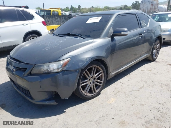 2011 Scion tC with VIN JTKJF5C72B3015652, listed as a IAAI auction lot 42087995 with 175,768 mi miles. Bid and sale history available at carsss.com. Image 2.