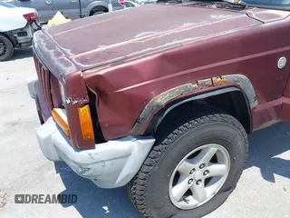 2000 Jeep Cherokee z VIN 1J4FF48S7YL129654, wystawiony jako IAAI lot #42201026 z przebiegiem 272 922 mil mil oraz . Historia ofert i sprzedaży dostępna na DreamBid. Obrazek 6.