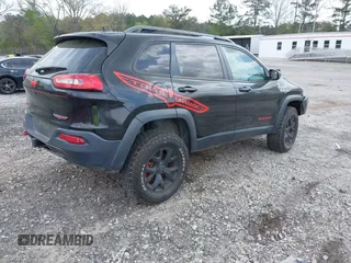 2015 Jeep Cherokee Trailhawk with VIN 1C4PJMBS5FW792184, listed as a IAAI auction lot 41827106 with 132,752 mi miles. Bid and sale history available at carsss.com. Image 4.