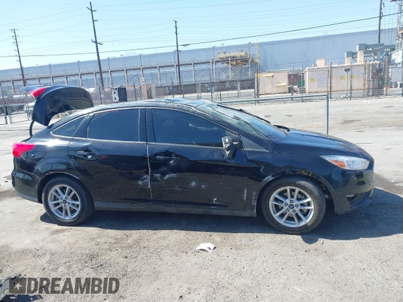 2018 Ford Focus SE z VIN 1FADP3FE9JL303933, wystawiony jako IAAI lot #42530171 z przebiegiem Nie podano mil oraz . Historia ofert i sprzedaży dostępna na DreamBid. Obrazek 12.
