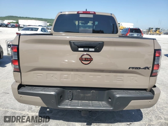 2023 Nissan Frontier Pro-4X with VIN 1N6ED1EK0PN668109, listed as a Copart auction lot 57064975 with 6,406 mi miles and Salvage title. Bid and sale history available at DreamBid. Image 6.