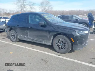 2023 BMW iX xDrive50 with VIN WB523CF02PCM45529, listed as a IAAI auction lot 41527811 with 33,429 mi miles. Bid and sale history available at carsss.com. Image 1.