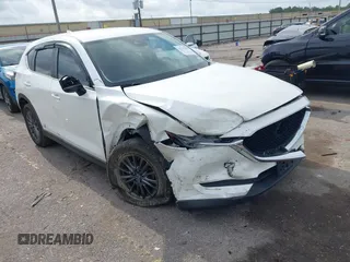 2020 Mazda CX-5 Touring z VIN JM3KFBCM2L0786784, wystawiony jako IAAI lot #42127457 z przebiegiem 62 665 mil mil oraz . Historia ofert i sprzedaży dostępna na DreamBid. Obrazek 1.