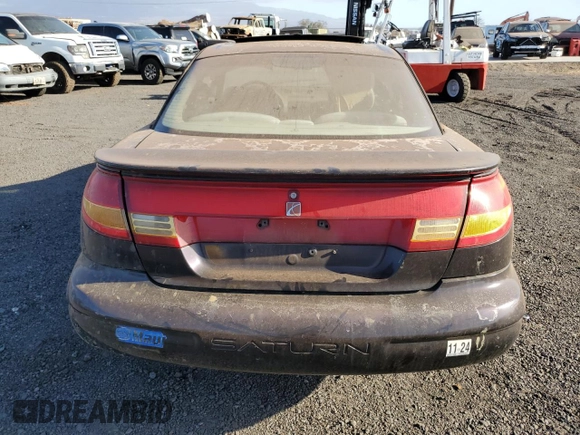 1999 Saturn SC z VIN 1G8ZR1274XZ262181, wystawiony jako Copart lot #75931774 z przebiegiem Nie podano mil oraz Szkoda całkowita • Salvage title. Historia ofert i sprzedaży dostępna na DreamBid. Obrazek 6.