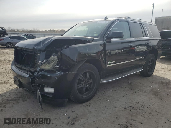 2015 GMC Yukon Denali with VIN 1GKS1CKJ1FR303049, listed as a Copart auction lot 82435514 with 100,693 mi miles and Salvage Title. Bid and sale history available at carsss.com. Image 1.