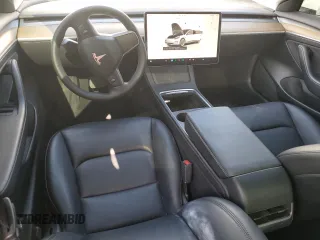 2023 Tesla Model 3 with VIN 5YJ3E1EA6PF510323, listed as a Copart auction lot 52094495 with 115,928 mi miles and Salvage Title. Bid and sale history available at DreamBid. Image 8.