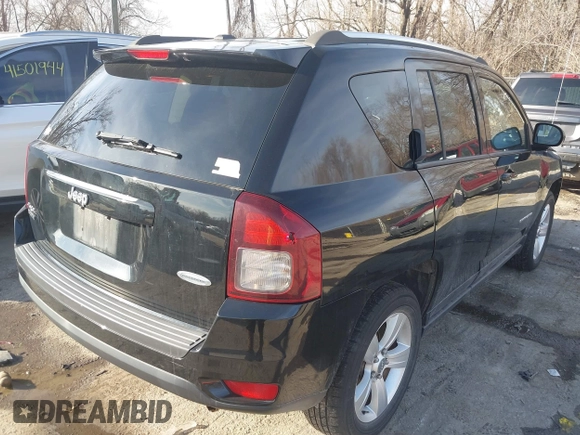 2014 Jeep Compass Latitude with VIN 1C4NJDEBXED661930, listed as a IAAI auction lot 41501558 with 94,133 mi miles and . Bid and sale history available at DreamBid. Image 4.