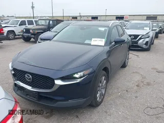 2023 Mazda CX-30 S Carbon Edition with VIN 3MVDMBCM1PM520066, listed as a IAAI auction lot 41877916 with 22,973 mi miles and . Bid and sale history available at carsss.com. Image 2.