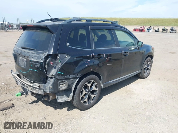 2015 Subaru Forester XT Touring with VIN JF2SJGUC5FH822632, listed as a IAAI auction lot 42032965 with 118,111 mi miles and . Bid and sale history available at DreamBid. Image 4.