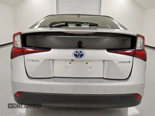 2021 Toyota Prius L Eco z VIN JTDKAMFU0M3140335, wystawiony jako Copart lot #61955845 z przebiegiem 96 071 mil mil oraz Czysty tytuł • Clean title. Historia ofert i sprzedaży dostępna na DreamBid. Obrazek 6.