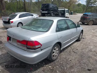 2002 Honda Accord EX z VIN 1HGCG56642A161161, wystawiony jako IAAI lot #41966381 z przebiegiem 258 103 mil mil oraz . Historia ofert i sprzedaży dostępna na DreamBid. Obrazek 4.