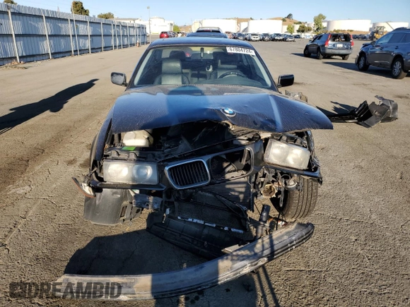 1999 BMW 3 Series 328is with VIN WBABG133XXET07976, listed as a Copart auction lot 67804724 with 139,337 mi miles and Salvage Title. Bid and sale history available at carsss.com. Image 5.