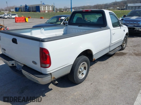 2002 Ford F-150 XL with VIN 1FTRF17W72NA67786, listed as a IAAI auction lot 41869585 with 180,262 mi miles. Bid and sale history available at carsss.com. Image 4.