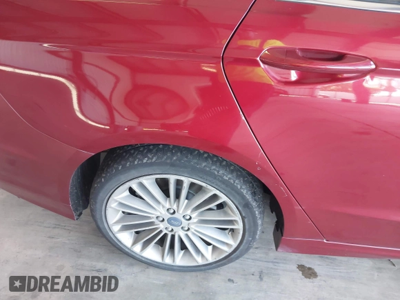 2013 Ford Fusion SE Hybrid z VIN 3FA6P0LU9DR183625, wystawiony jako IAAI lot #42338533 z przebiegiem 159 546 mil mil oraz . Historia ofert i sprzedaży dostępna na DreamBid. Obrazek 16.