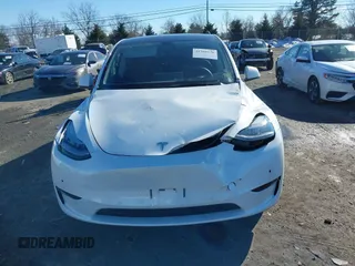 2022 Tesla Model Y Long Range with VIN 7SAYGDEE2NF440548, listed as a IAAI auction lot 41360276 with 19,714 mi miles and . Bid and sale history available at carsss.com. Image 12.