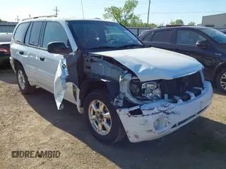 2003 GMC Envoy SLT z VIN 1GKDS13S632397919, wystawiony jako IAAI lot #42035397 z przebiegiem 166 943 mil mil oraz . Historia ofert i sprzedaży dostępna na DreamBid. Obrazek 1.