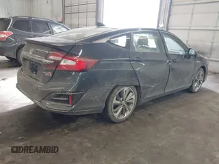 2018 Honda Clarity Touring z VIN JHMZC5F39JC002521, wystawiony jako IAAI lot #41428968 z przebiegiem 64 014 mil mil oraz . Historia ofert i sprzedaży dostępna na DreamBid. Obrazek 4.