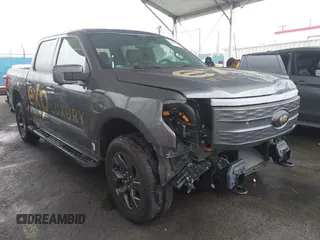 2022 Ford F-150 Lightning Pro z VIN 1FTVW1EL8NWG14070, wystawiony jako IAAI lot #41776980 z przebiegiem 14 812 mil mil oraz . Historia ofert i sprzedaży dostępna na DreamBid. Obrazek 1.