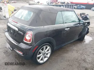 2013 MINI Convertible S with VIN WMWZP3C54DT297304, listed as a IAAI auction lot 41377572 with 101,991 mi miles and . Bid and sale history available at DreamBid. Image 4.