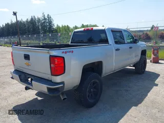 2014 Chevrolet Silverado 1500 LT with VIN 3GCUKREH0EG399090, listed as a IAAI auction lot 42142324 with 104,226 mi miles and . Bid and sale history available at DreamBid. Image 4.
