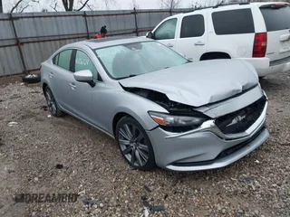 2019 Mazda 6 Touring with VIN JM1GL1VM7K1500824, listed as a IAAI auction lot 41106729 with 111,292 mi miles and . Bid and sale history available at carsss.com. Image 1.