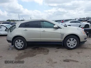 2014 Cadillac SRX Luxury Collection z VIN 3GYFNBE31ES628346, wystawiony jako IAAI lot #41709425 z przebiegiem 47 634 mil mil oraz . Historia ofert i sprzedaży dostępna na DreamBid. Obrazek 13.