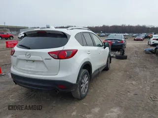 2014 Mazda CX-5 Sport with VIN JM3KE2BE8E0422322, listed as a IAAI auction lot 42009499 with 166,966 mi miles and . Bid and sale history available at carsss.com. Image 4.