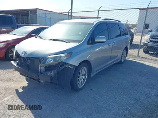 2011 Toyota Sienna SE with VIN 5TDXK3DC8BS131434, listed as a IAAI auction lot 42002675 with 209,396 mi miles. Bid and sale history available at carsss.com. Image 2.