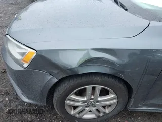 2015 Volkswagen Jetta S z VIN 3VW2K7AJ6FM217381, wystawiony jako IAAI lot #42371909 z przebiegiem 237 510 mil mil oraz . Historia ofert i sprzedaży dostępna na DreamBid. Obrazek 12.