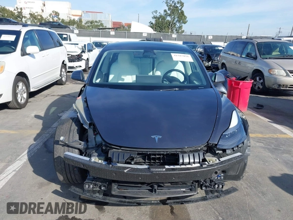 2023 Tesla Model 3 Performance with VIN 5YJ3E1EC4PF705449, listed as a IAAI auction lot 41587026 with 30,292 mi miles. Bid and sale history available at carsss.com. Image 13.