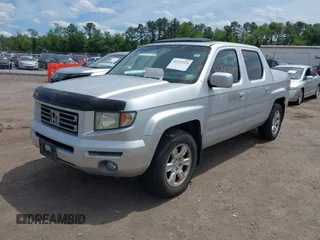 2006 Honda Ridgeline RTL with VIN 2HJYK16566H550339, listed as a IAAI auction lot 42223323 with 240,372 mi miles and . Bid and sale history available at DreamBid. Image 2.