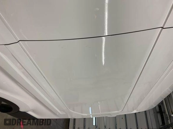2023 Ford Transit Cargo z VIN 1FTBR1X85PKA75596, wystawiony jako IAAI lot #42742859 z przebiegiem 45 875 mil mil oraz . Historia ofert i sprzedaży dostępna na DreamBid. Obrazek 10.