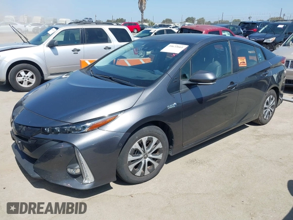 2021 Toyota Prius LE with VIN JTDKAMFP3M3167586, listed as a IAAI auction lot 39672661 with 42,050 mi miles and . Bid and sale history available at DreamBid. Image 2.