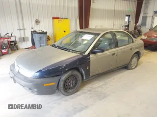 1999 Saturn SL z VIN 1G8ZF5287XZ157353, wystawiony jako IAAI lot #42310900 z przebiegiem 372 049 mil mil oraz . Historia ofert i sprzedaży dostępna na DreamBid. Obrazek 2.