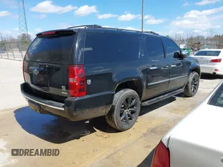 2010 Chevrolet Suburban LTZ with VIN 1GNUKKE39AR106851, listed as a IAAI auction lot 41994155 with 148,776 mi miles. Bid and sale history available at carsss.com. Image 4.