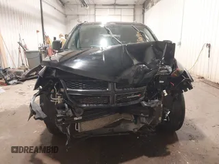 2017 Dodge Journey SE z VIN 3C4PDCAB4HT695490, wystawiony jako IAAI lot #41301719 z przebiegiem 103 642 mil mil oraz . Historia ofert i sprzedaży dostępna na DreamBid. Obrazek 13.