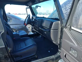 1999 Jeep Wrangler Sport with VIN 1J4FY19SXXP456810, listed as a IAAI auction lot 41725834 with 93,151 mi miles. Bid and sale history available at carsss.com. Image 5.
