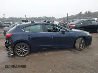 2018 Mazda 3 Touring with VIN 3MZBN1L34JM204883, listed as a IAAI auction lot 41094541 with 125,205 mi miles and . Bid and sale history available at DreamBid. Image 13.
